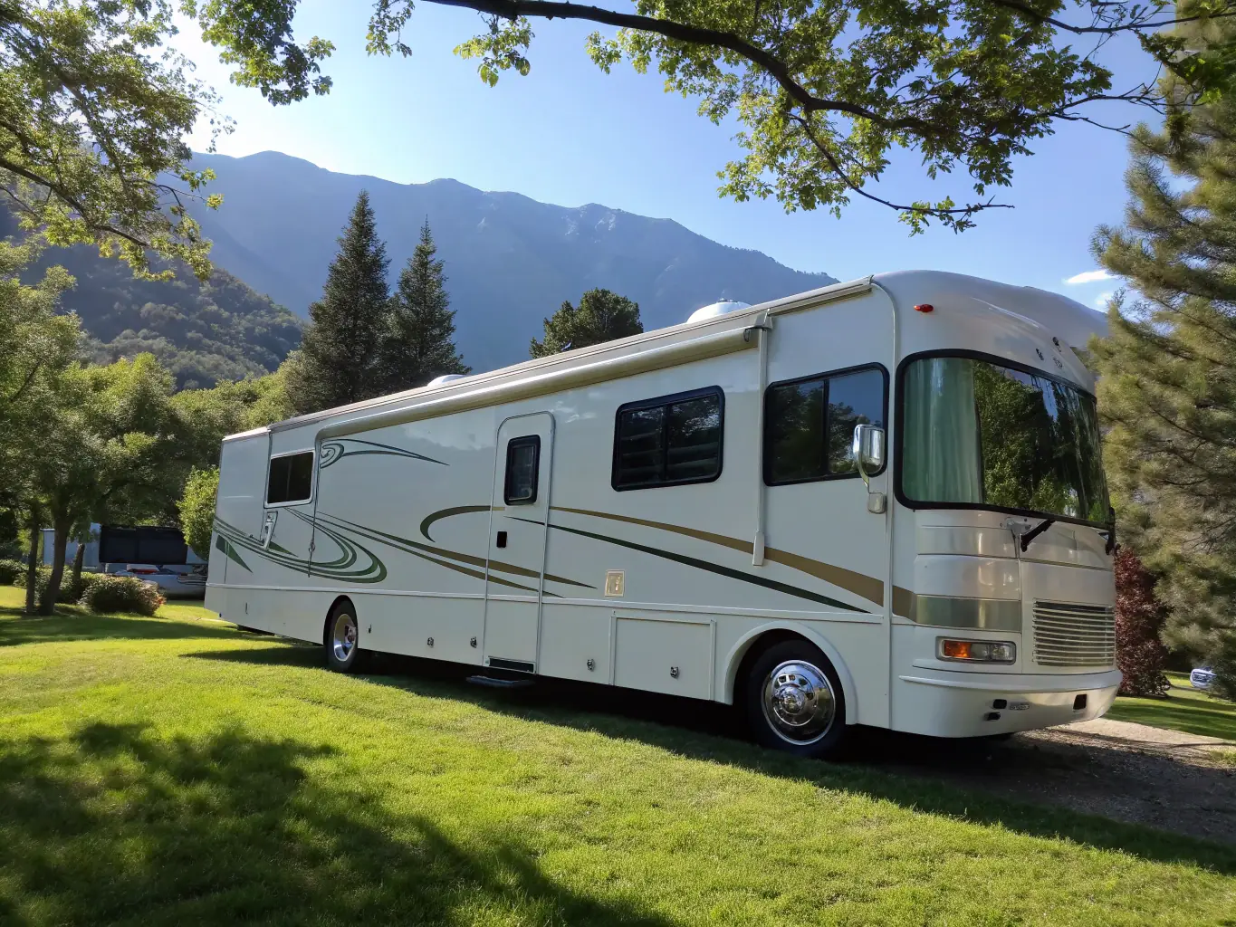 A gleaming white RV and a sleek boat parked side by side, both being detailed by uniformed staff, with clear blue skies and lush greenery in the background, emphasizing outdoor recreational lifestyle.